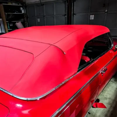 A full view of the red rag convertible top from the passanger side before the window install.